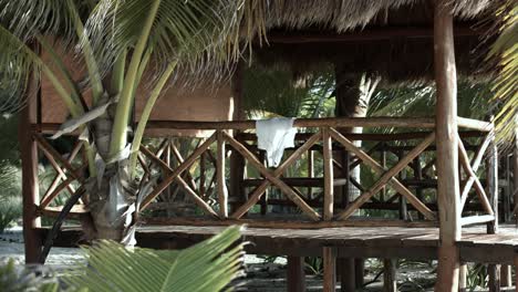 White-tank-top-air-drying-at-a-beach-hut