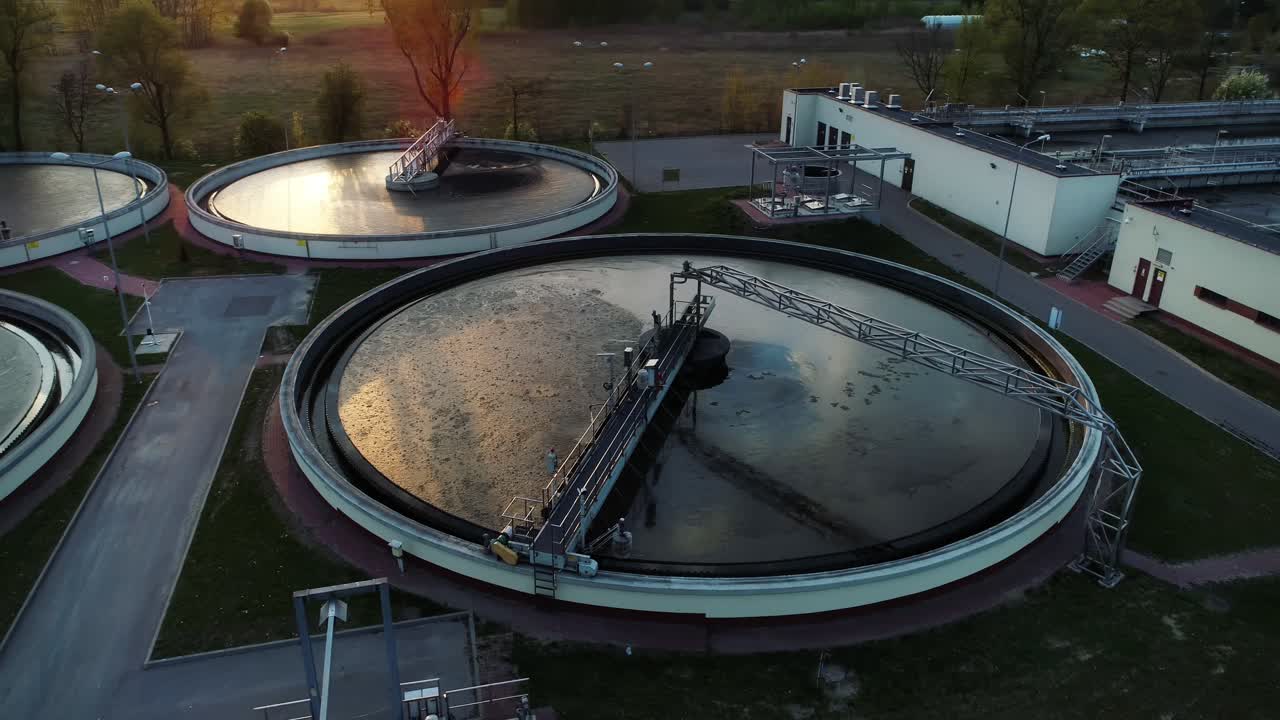Aerial view of sewage treatment plant, camera moving around