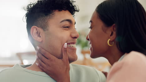 face, love and couple in a living room relax