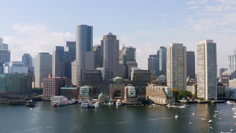 aerial over boston harbor approaching the boston skyline