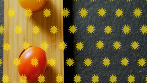 yellow star patterns animation over tomatoes on wooden and dark surfaces