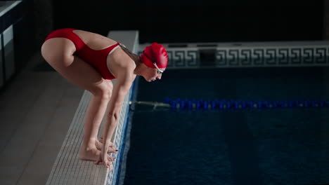 woman diving into swimming pool