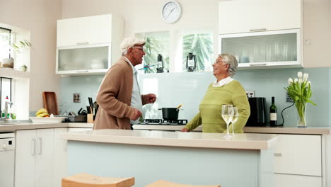 Happy Elderly Couple Dancing in Kitchen