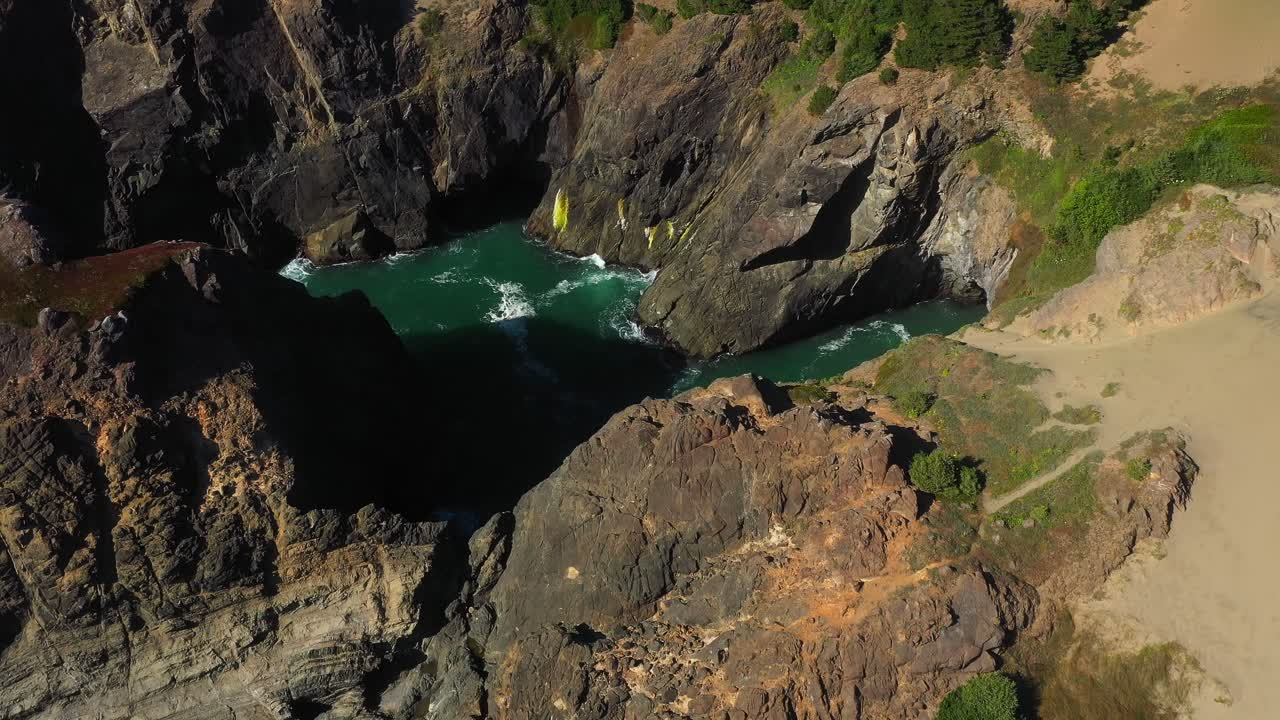 Majestic aerial view of Oregon landscape and rocky coastline revealing ocean canyon in the Pacific Northwest, USA.