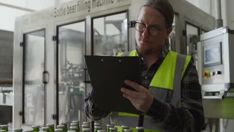 caucasian man working at a microbrewery