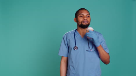 Male-nurse-enjoying-fresh-cup-of-coffee-during-job-shift-break