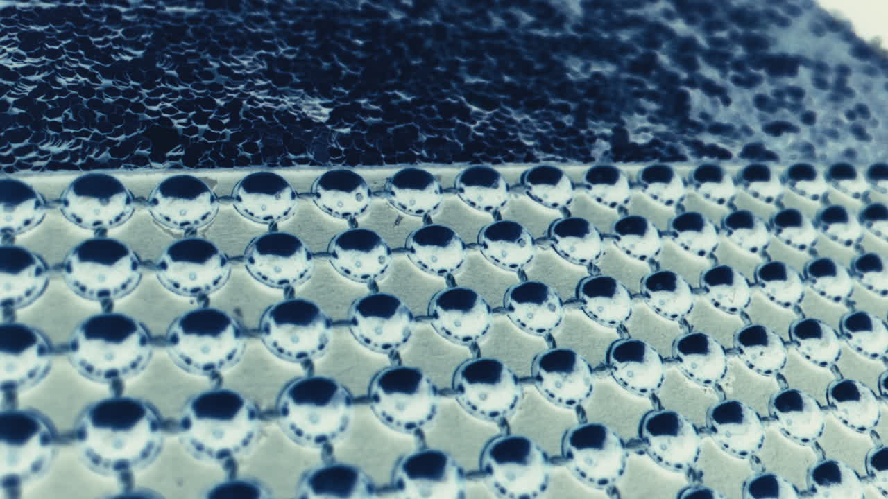 Close-up of a decorative metal button pattern