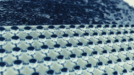 close-up of a decorative metal button pattern