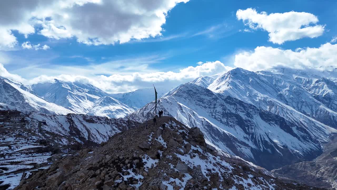 Snowy Mountain Peaks with People