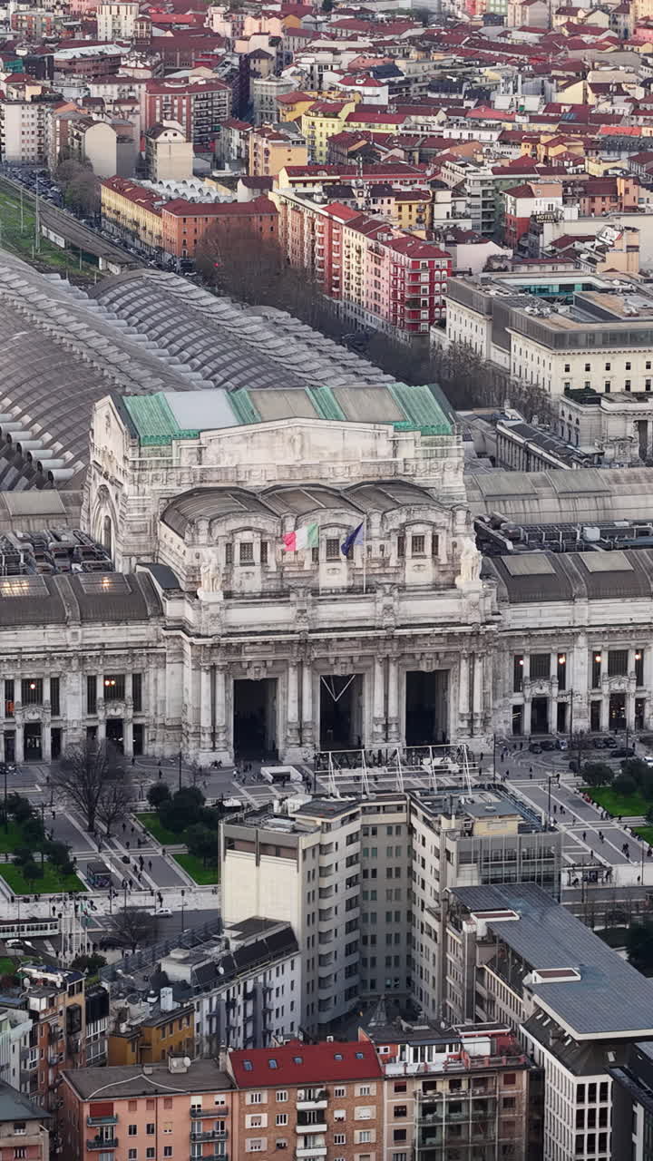 Aerial drone view of the Milan Central Railway Station in Italy in daylight. Vertical