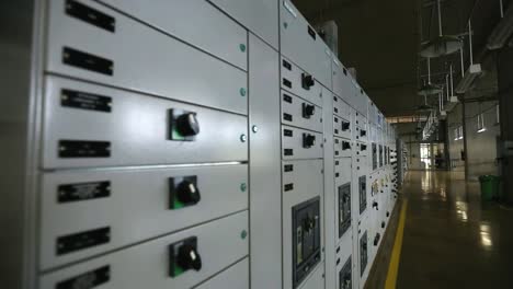 rack focus shot across a control interface inside of a water processing plant