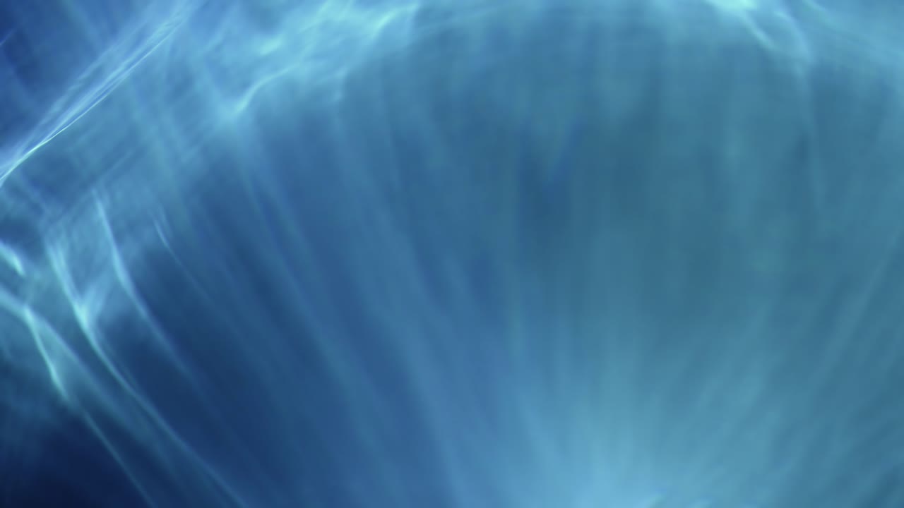 Motivi di luce blu astratti in movimento e in dissolvenza
