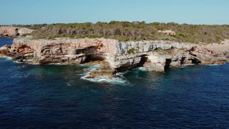 Waves-Hit-The-Rugged-Seacoast-Of-Caló-d'en-Perdiu-In-Mallorca,-Spain