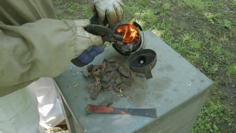 beekeeper lighting smoker with dry bark