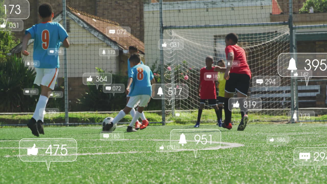 boys advancing on goal on artificial turf, showing floating social media tech graphics