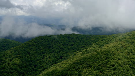 cinematic flight through mist and clouds converging on smoky peaks