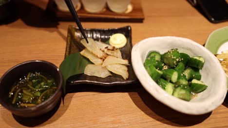 sequence of japanese dishes being served