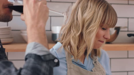 Red-wine,-cheers-and-couple-in-kitchen-cooking