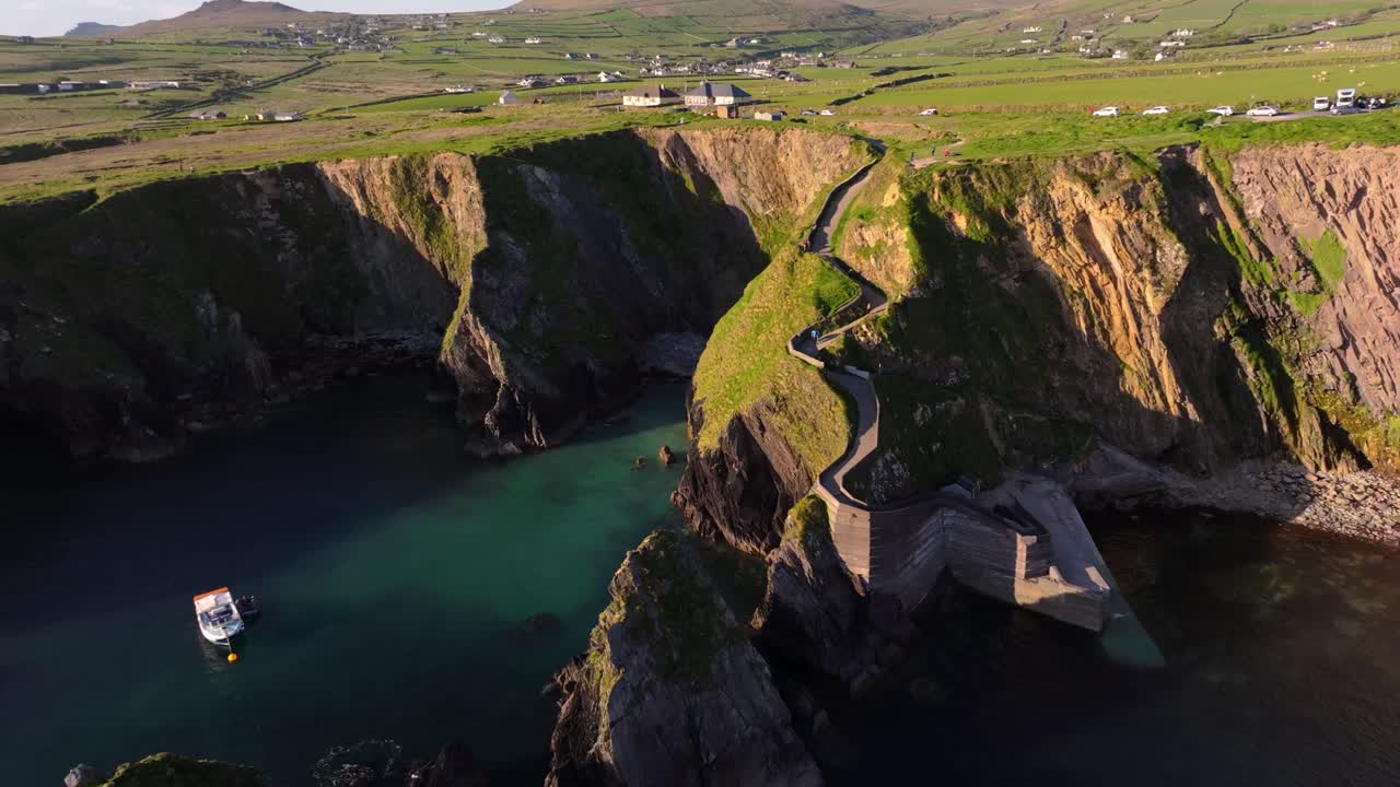 Dunquin Pier, with dramatic skies and sea views - Dingle Co.Kerry - 4K Cinematic Drone Footage 01
