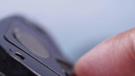 close-up of loading film into a vintage camera