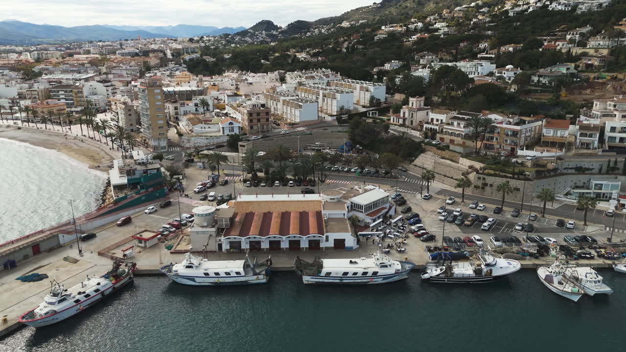 Marina expands across full view with distinct docks and parked vessels