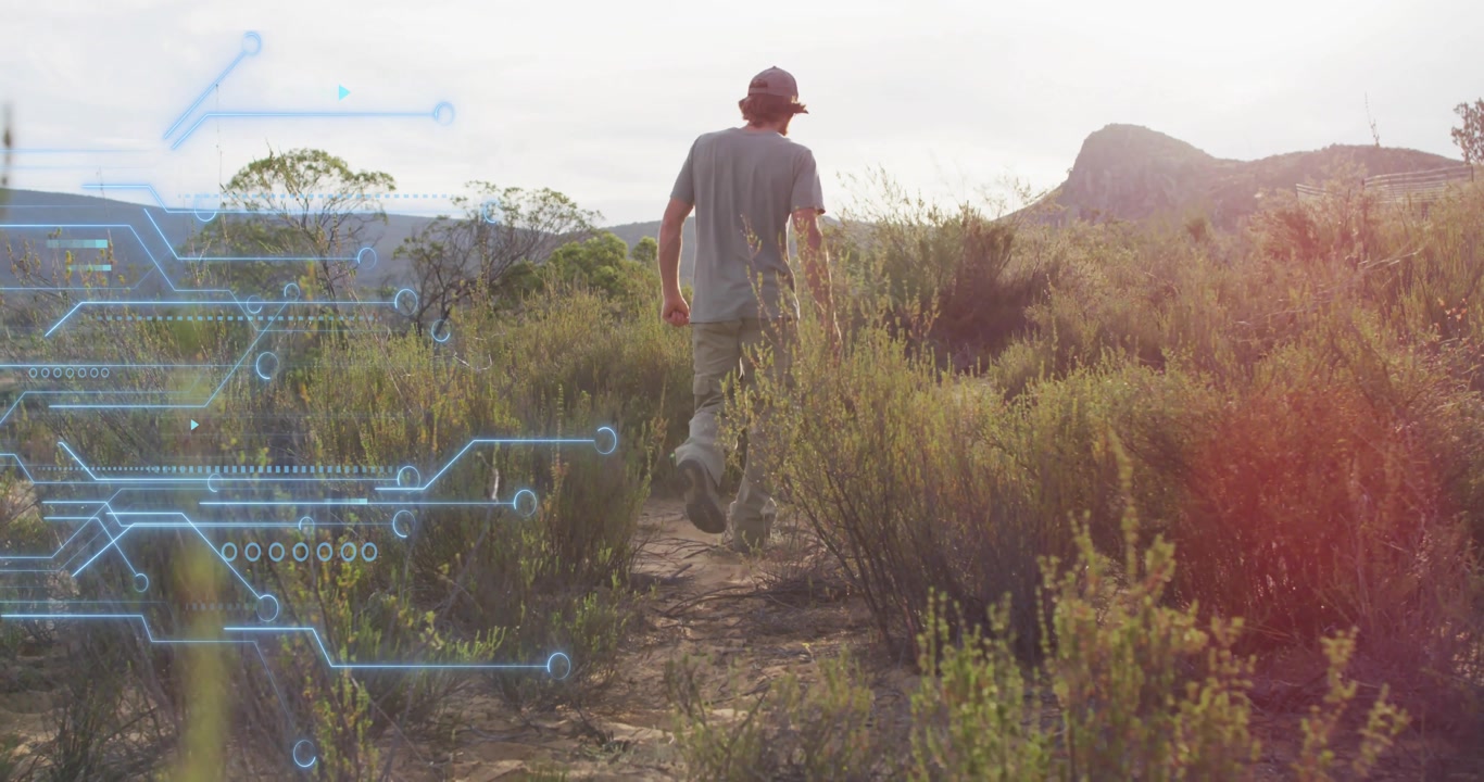 Male hiker taking first step onto trail and initiating environmental scan via circuit overlay