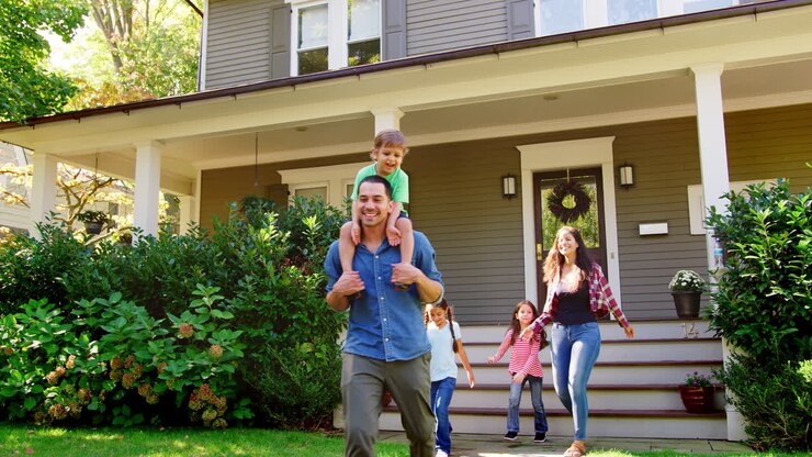 Father Gives Son Ride On Shoulders As Family Leave House