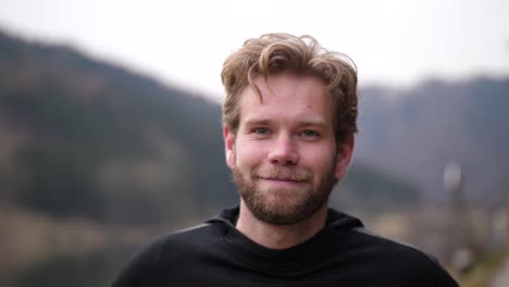 a somewhat serious-looking man winks at the cute cameraman before giving a nice laugh, obviously delighted