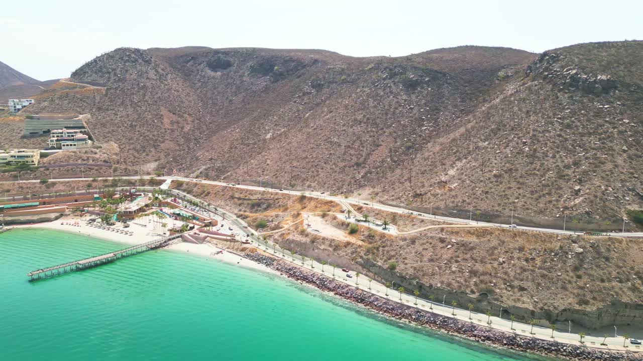 Coromuel beach, la paz, with clear turquoise water and scenic hills, aerial view