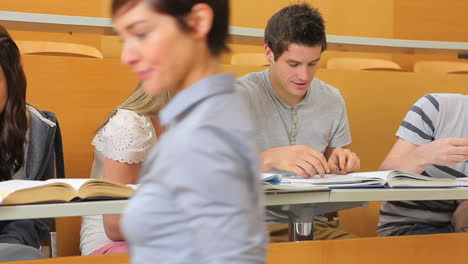 student showing friend smartphone