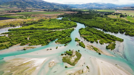 clutha river with green vegetation near the bendigo freedom camping ground in new zealand