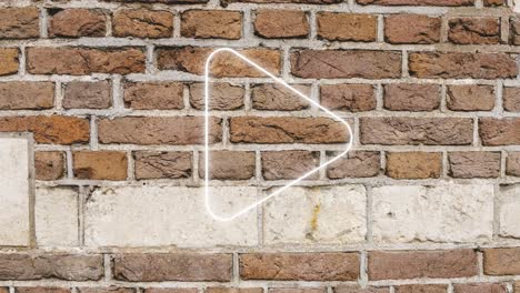 animation of glowing neon arrow icon on brick wall