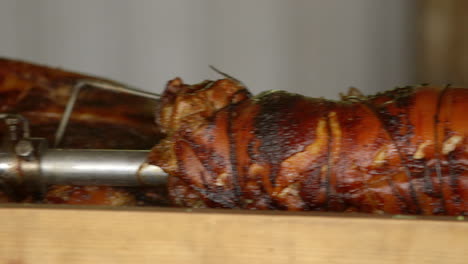 closeup on a whole roasted pig at a barbecue