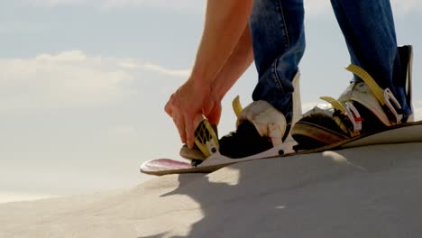 Man-wearing-sandals-in-the-desert-4k