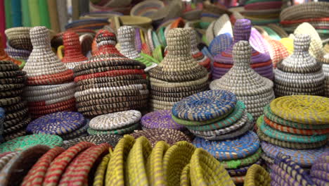 handmade colorful straw containers and pots selling on the market as a decorative baskets