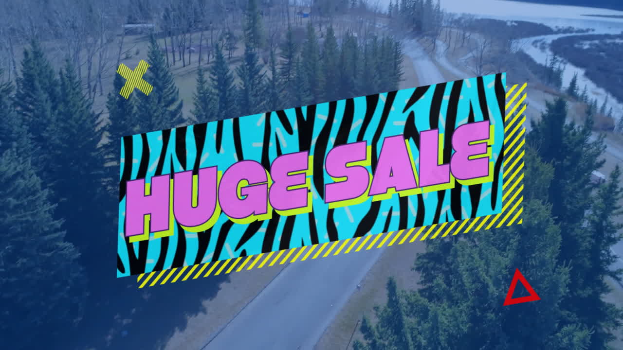 Marketing banner floating over winding evergreen forest road beside river, highlighting huge sale