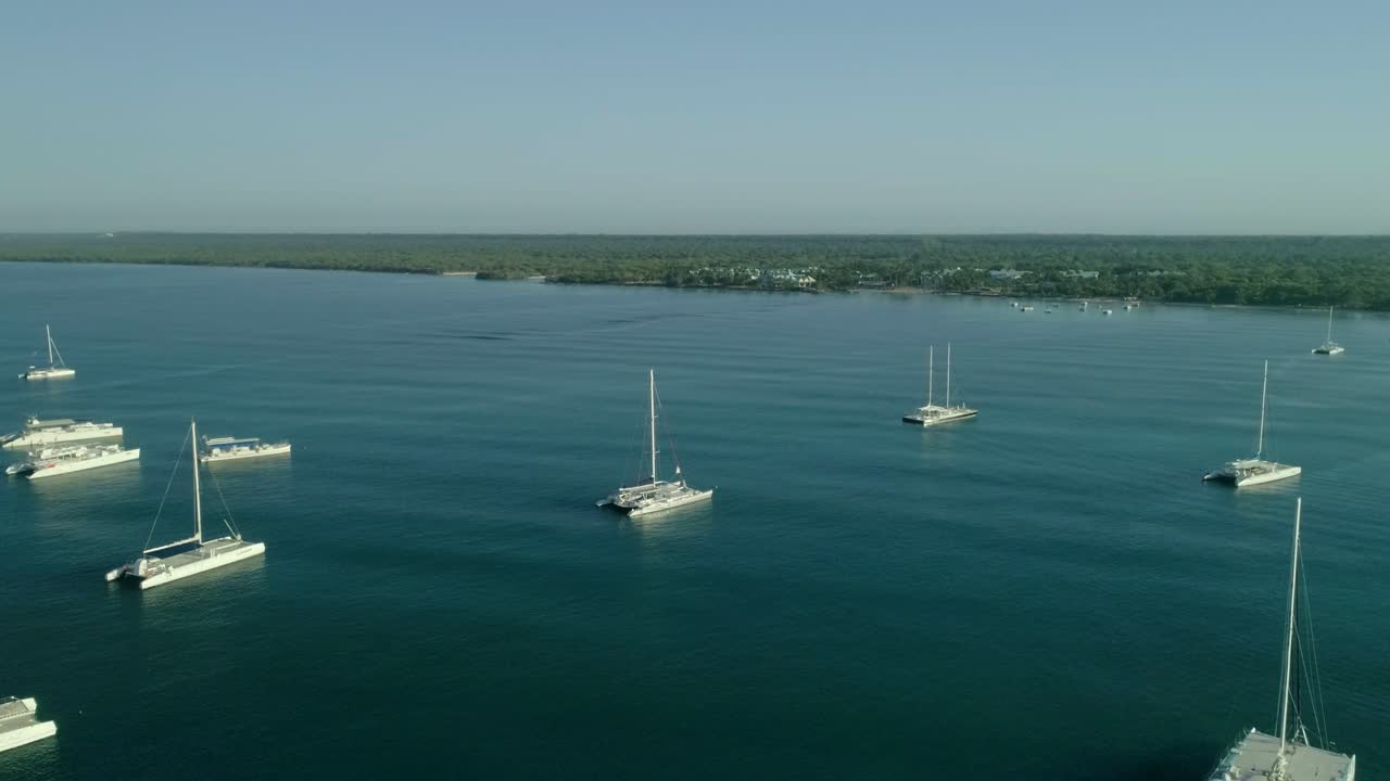 Group of boats moored in Bayahibe bay in Dominican Republic. Aerial circling