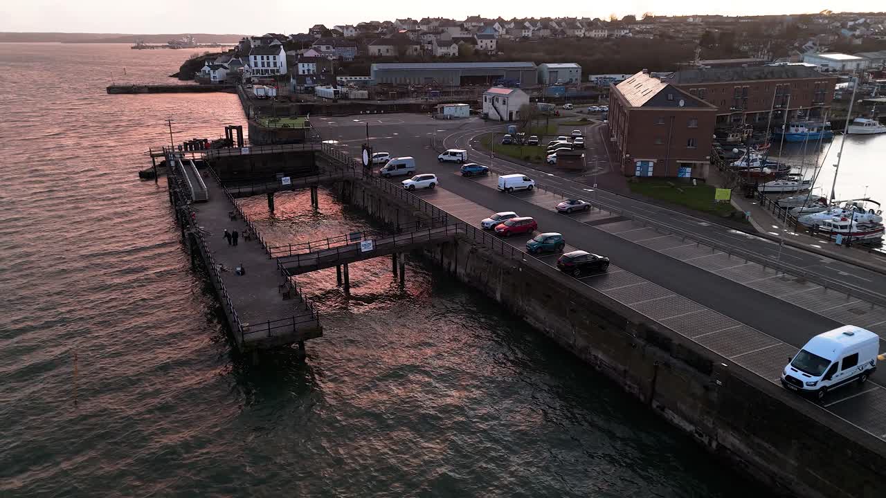 Scenic view of Milford Waterfront in Pembrokeshire with cars parked along the pier