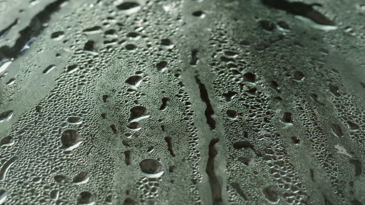 Water Droplets on a Condensing Surface