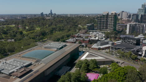 Aerial-perspective-looking-down-St-Kilda-Road,-over-head-of-the-NGV-in-Melbourne-Australia