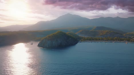 sunset over a coastal bay with mountains