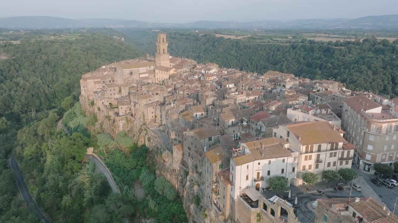 Aerial Drone view of the hilltop Medieval town of Pitigliano, Tuscany in morning light, with the Valdorcia and old buildings, in 4K