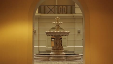 picturesque entrance to the bellevue on philadelphia, pa - aesthetic yellow and orange fountain