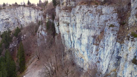 aerial of shadowed cliffs in wandfluh solothurn, switzerland