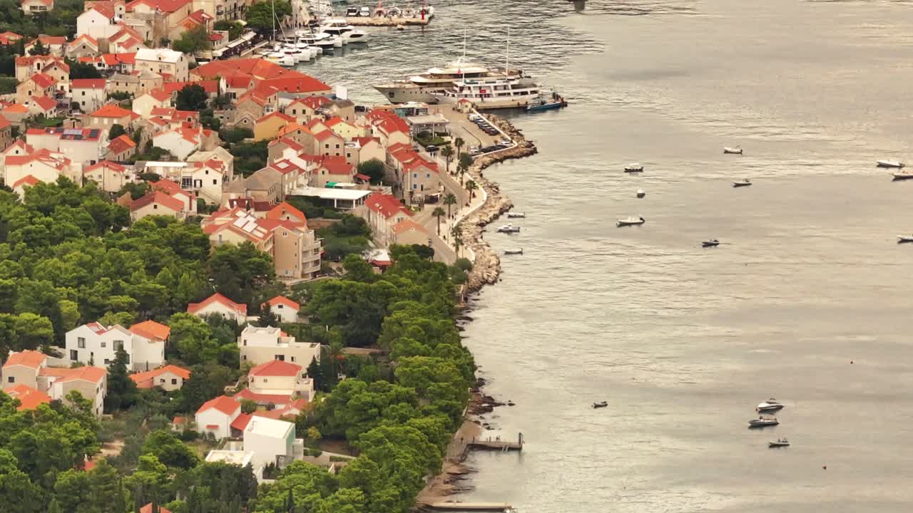 Discover the charm of Bol, the oldest town on Brač Island, with this breathtaking aerial footage. Admire its beautiful coastline, historic streets, and stunning Adriatic views