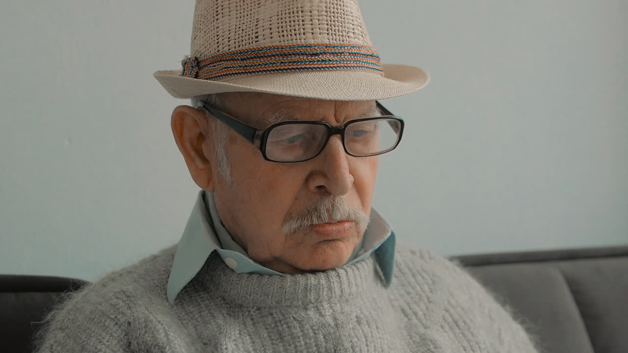 Portrait Of Elderly Man Reading