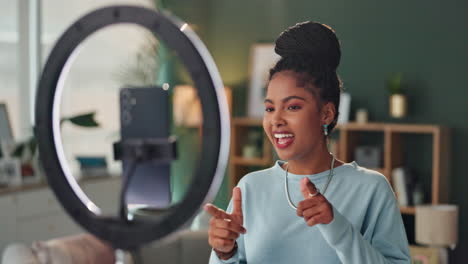 woman recording video with ring light