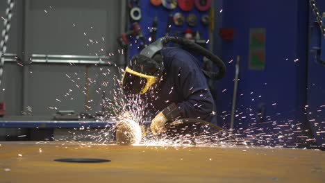 worker-using-an-angle-grinder-on-metal