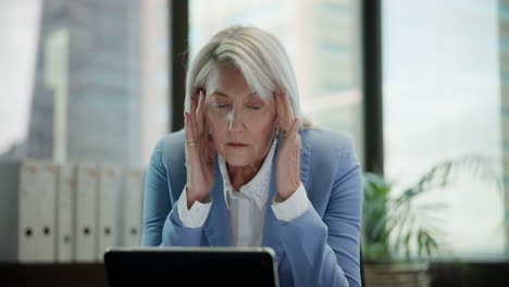 stressed businesswoman in office