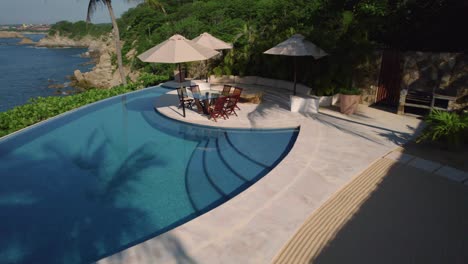 vacation at luxurious resort with relaxing swimming pool and umbrella seating near beach